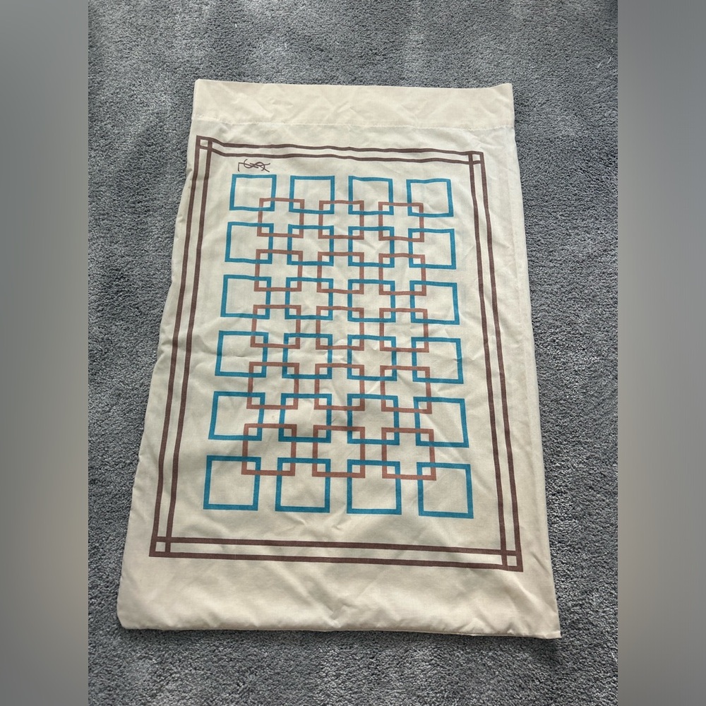 Yves Saint Laurent Cream pillow case with Blue and Brown Design